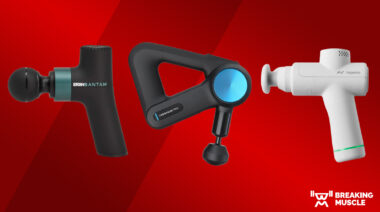 Three massage guns on a red background