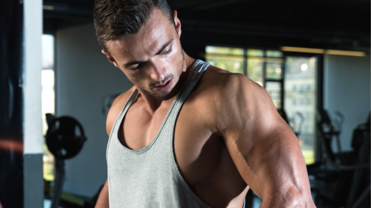 A person looking at their biceps brachii.