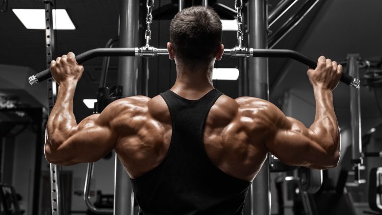 Man performing cable lat pulldowns.