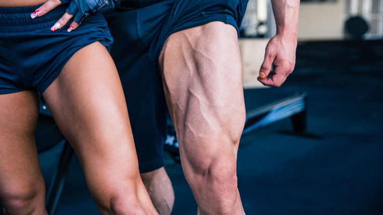 Man and woman flexing muscular legs